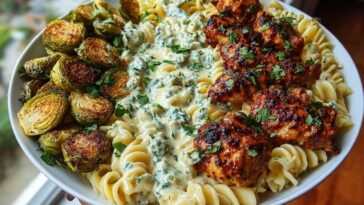 Hot Honey Cajun Chicken Alfredo with Basil Feta Swirl & Crispy Brussels Chips